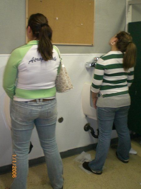 Guys peeing in urinals