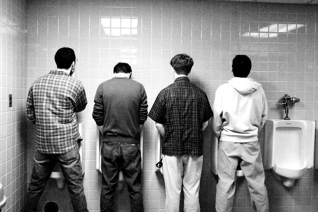 Guys peeing in urinals